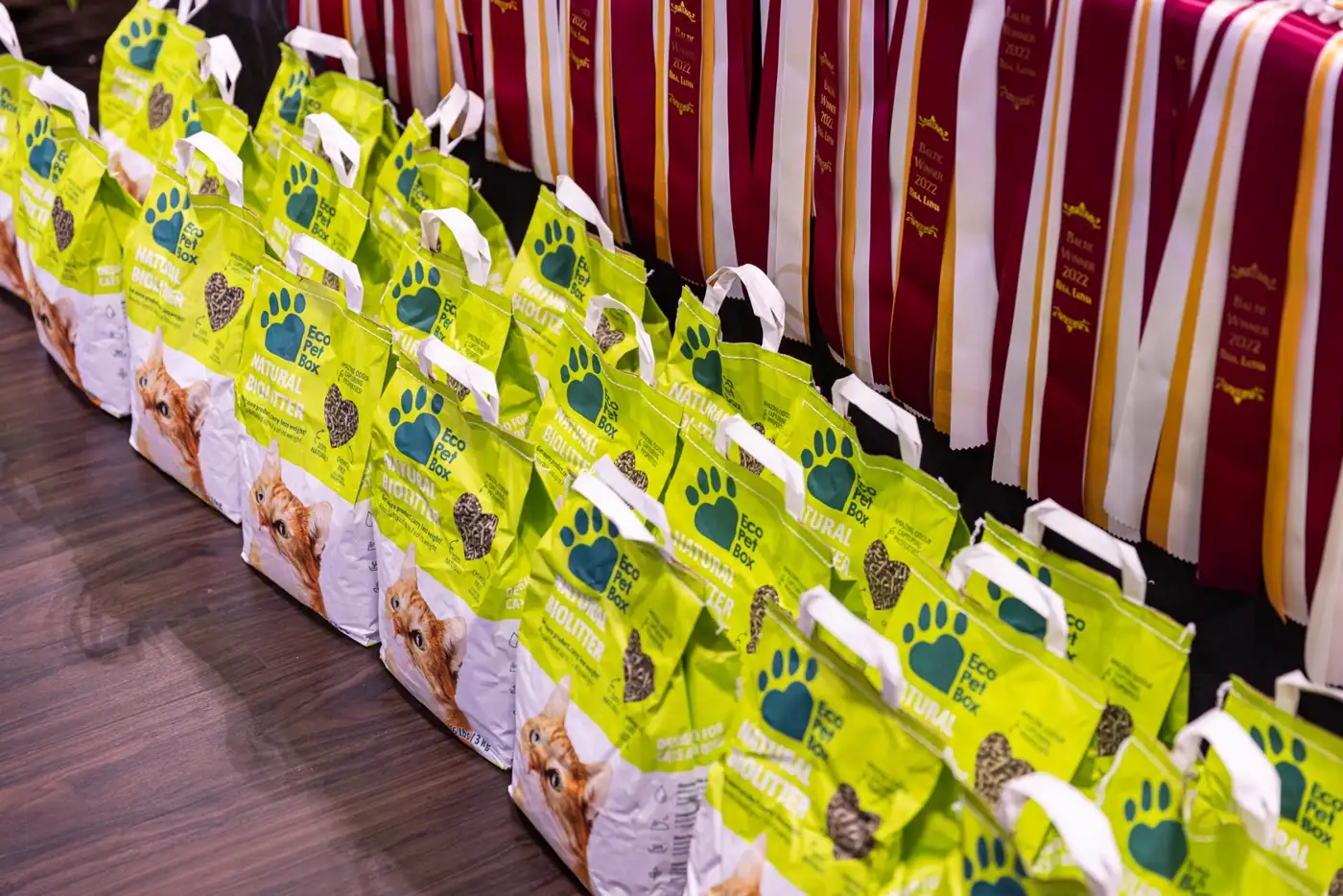 Rows of EcoPetBox Natural Biolitter bags displayed at the FIFe Baltic Winner Show 2022